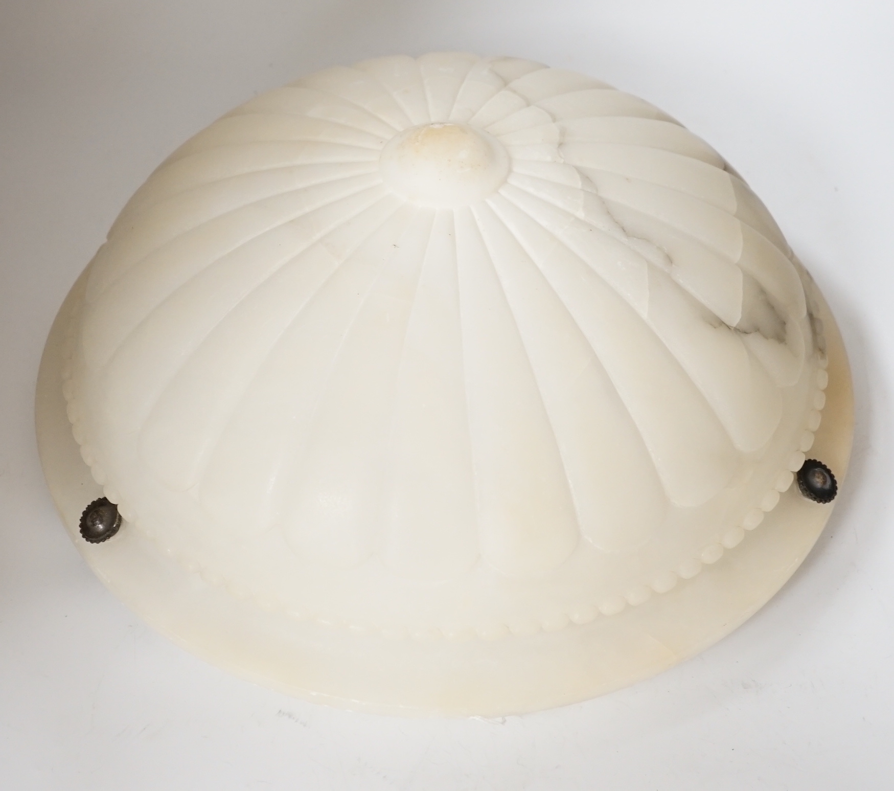 A carved alabaster ceiling shade, with three chains, diameter 40cm